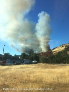 Photo of Pawnee Fire burning on a hill in Lake County