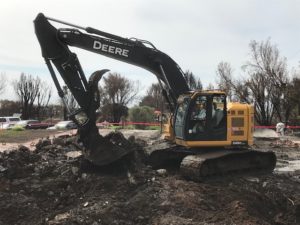 State contractors remove debris caused by the Woolsey Fire from a home in Malibu whose owner is participating in the state's Consolidated Debris Removal Program.