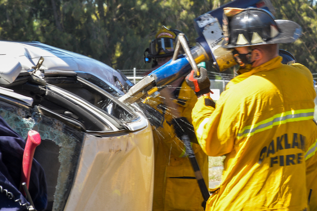 Firefighter Works to Access "Victim" through Car