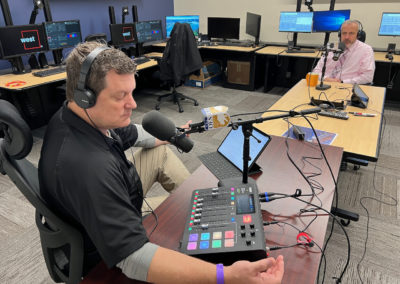 Budge Currier talks with Shawn Boyd at 911 test lab in Sacramento