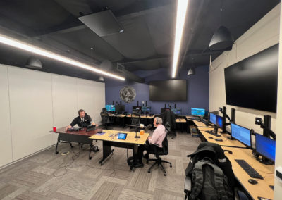 Budge Currier talks with Shawn Boyd at 911 test lab in Sacramento