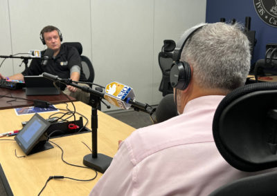 Budge Currier talks with Shawn Boyd at 911 test lab in Sacramento