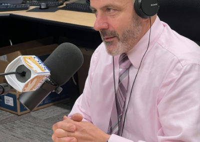 Budge Currier talks with Shawn Boyd at 911 test lab in Sacramento