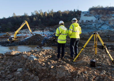 California Department of Water Resources Acting Director Bill Croyle, right, viewed the heavy equipment work early Wednesday morning across the diversion pool as crews started the first full day of debris removal from the diversion pool at the base of the damaged Oroville Dam spillway.