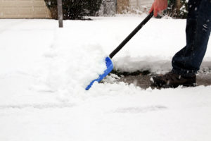 Person shoveling snow.