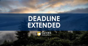 Forest skyline background with opaque blue box overlay with white text that reads "DEADLINE EXTENDED" and the Cal OES logo in the center under the text.