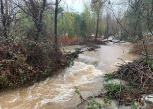 A rushing river in Placer County caused by winter storms.