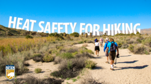 hikers walking on a trail with the words Heat Safety for Hiking