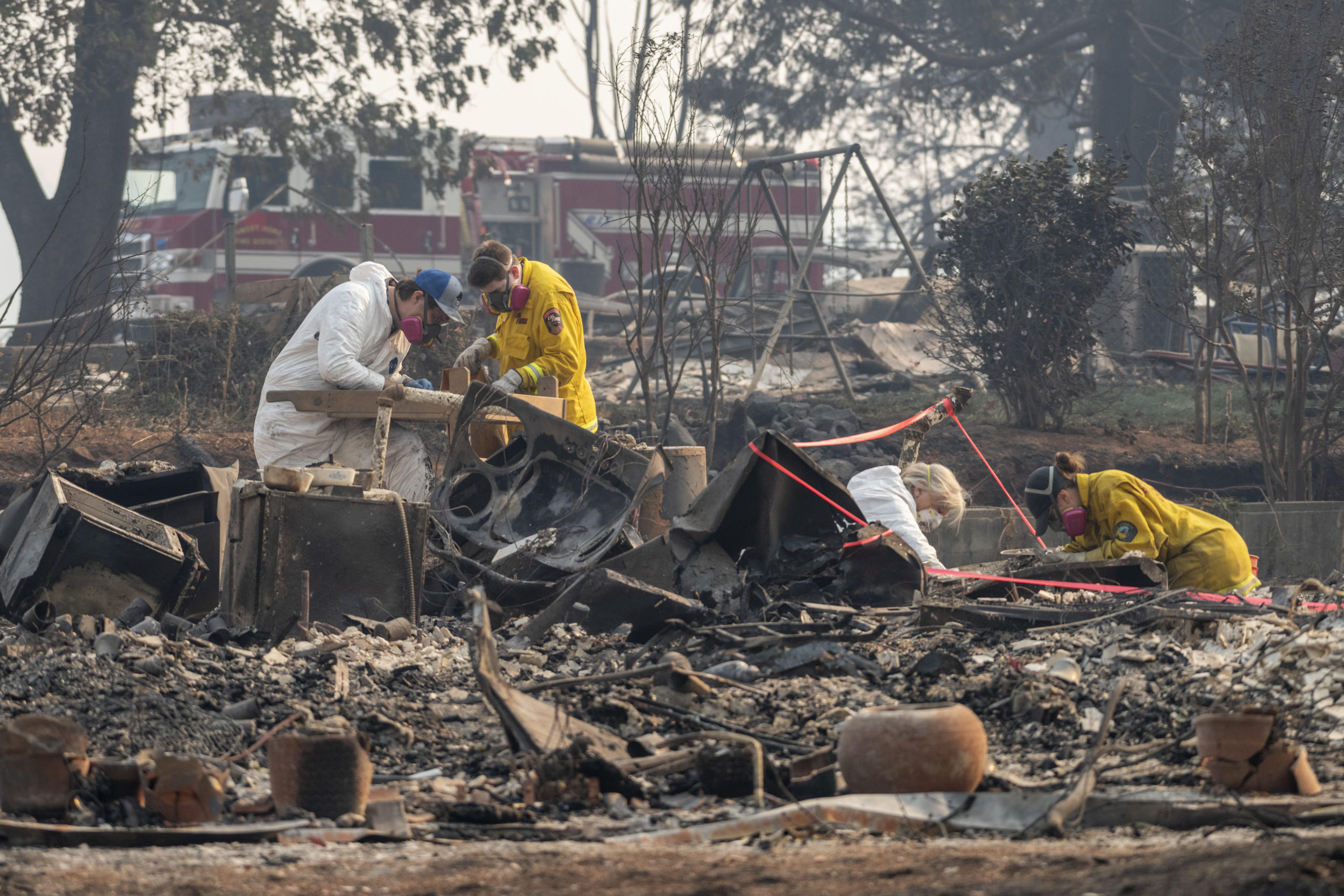Anthropology faculty Eric Bartelink, CSU Chico student Maghan Maberry, Alison Galloway of UC Santa Cruz, CSU Chico student Mallory Peters (left to right) and a team of anthropologists work to identify human remains consumed by the Camp Fire that continues to impact the area on Friday, November 16, 2018 in Paradise, Calif. (Jason Halley/University Photographer/CSU Chico)