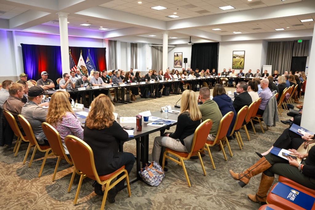 photo of county representatives sitting around table.