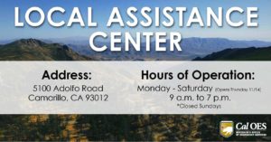 A graphic reading, “LOCAL ASSISTANCE CENTER” in large white text on the top half. A slightly opaque white bar covers the second half where text reads, “Address: 5100 Adolfo Road Camarillo, CA 93012. Hours of Operation: Monday – Saturday (opens Thursday 11/14) 9 a.m. – 7 p.m. Asterisk closed Sundays. ” The graphic is over a scenic photo of a mountainous canyon. A California Governor’s Office of Emergency Services logo is in the bottom right corner.