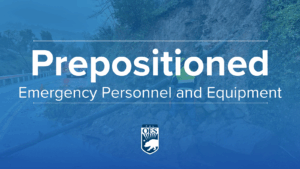 Emergency personnel and a collapsed roadway from debris flow with text that reads prepositioned emergency personnel and equipment.