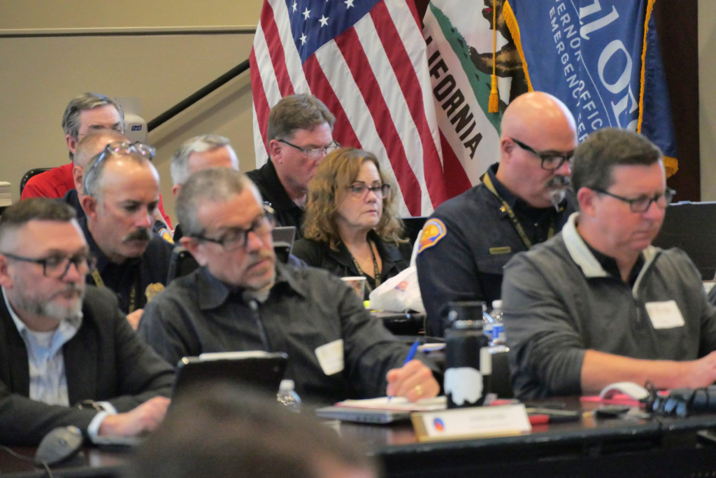 photo of fire chiefs sitting at a table