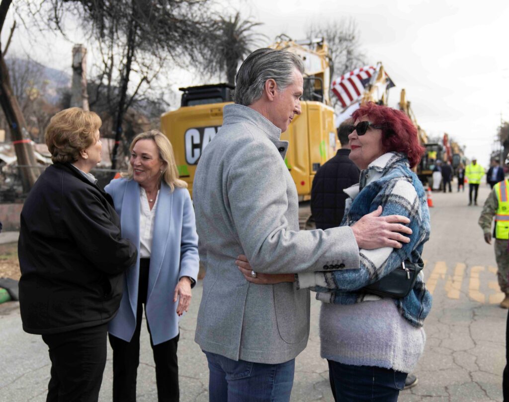 Governor newsom holding a survivor